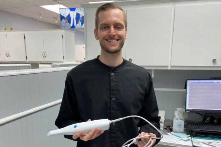 Dr. Fischman holds a Medit i500 Intraoral Scanner at Nebraska Dental